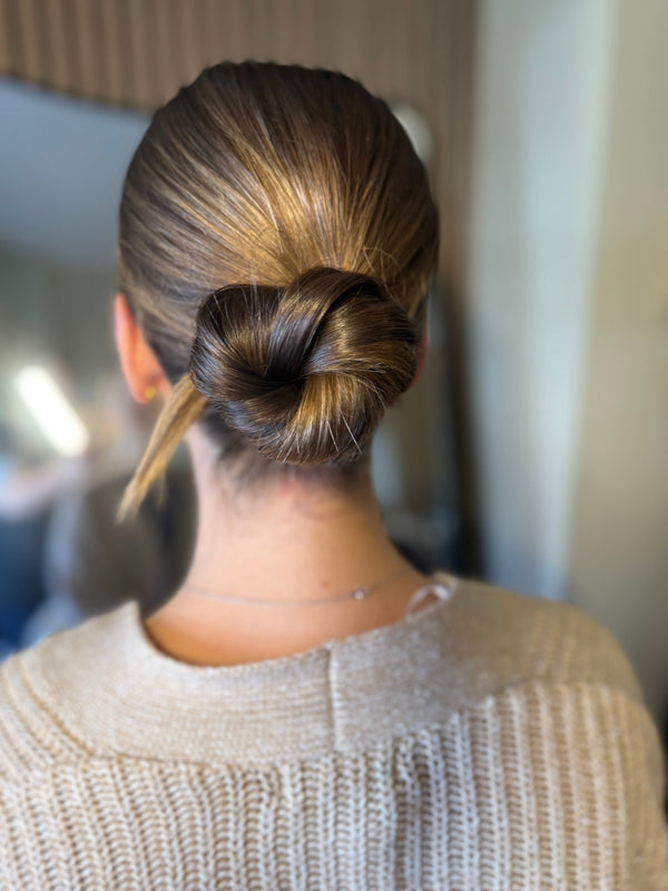 Clean bun wedding look